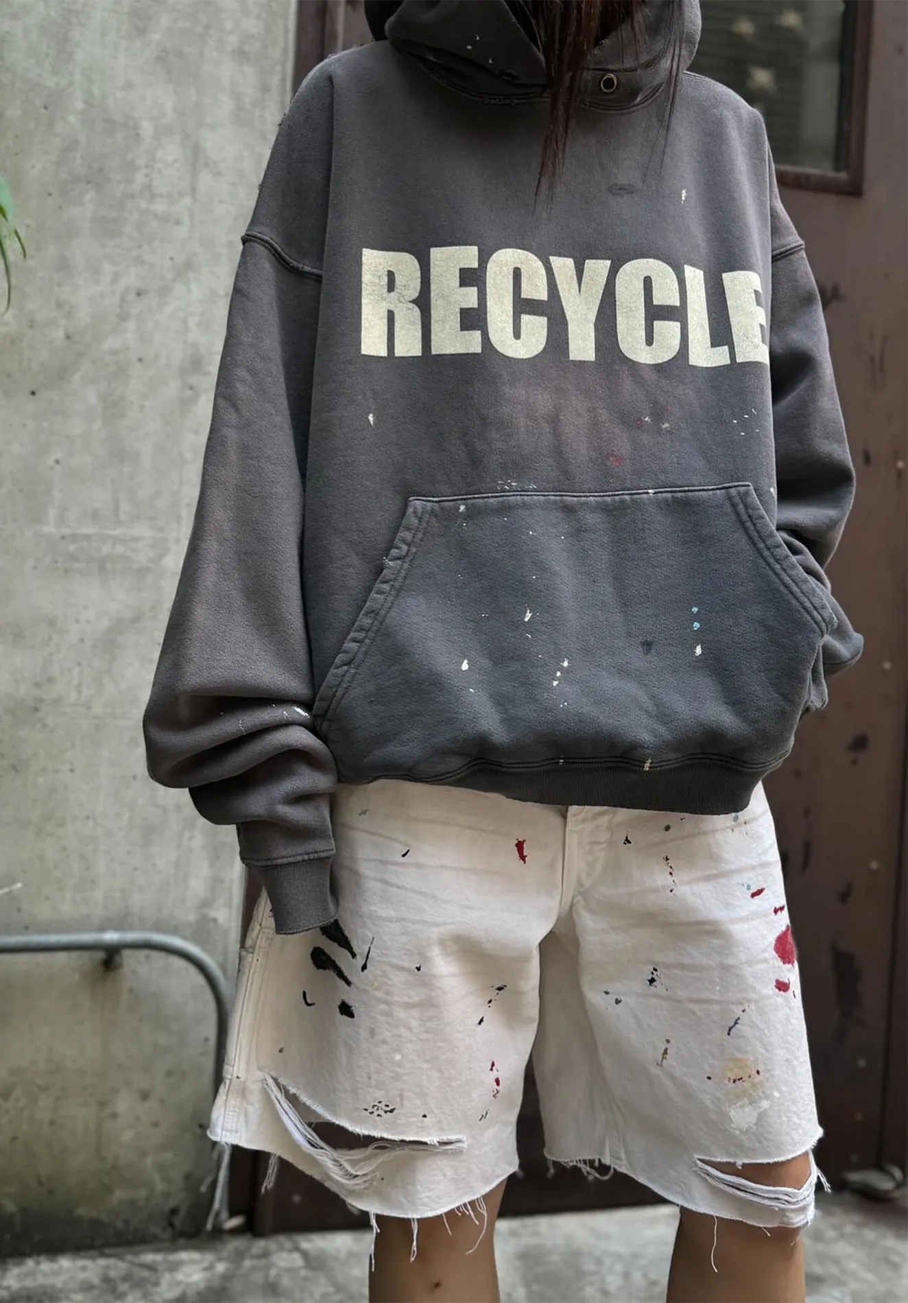 GALLERY DEPT. 90'S RECYCLE HOODIE WASHED BLACK 90'S washed hoodie with distressed eco-friendly slogans. Washed black S-XL. Ready-made garments are washed and dyed again. Multiple spots throughout the body are spray-faded. The ribs are cut and worn.